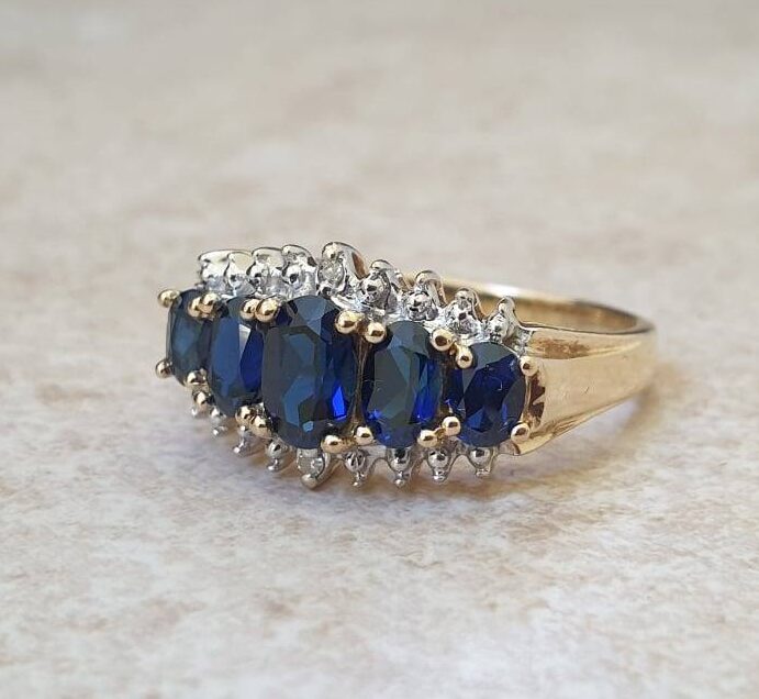 Graduating Synthetic Sapphire Five Stone Ring in 10k Gold.