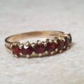 Seven Stone Garnet Band in 9ct Gold, a UK L 1/2 or a US 6