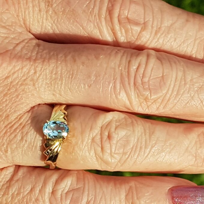 Oval Sky Blue Topaz Solitaire Ring in 9ct Gold, a UK J or a US 5.
