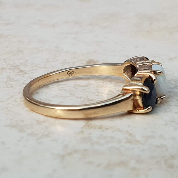 Opal and Sapphire Trilogy Ring in 9ct Gold, a UK J 1/2 or a US 5 1/4.