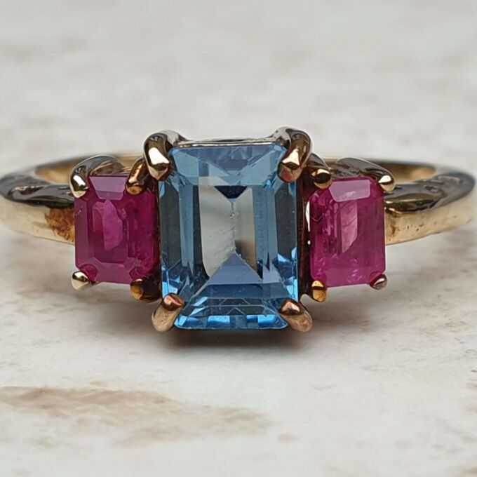 Topaz and Synthetic Ruby Trilogy Ring in 9ct Gold.
