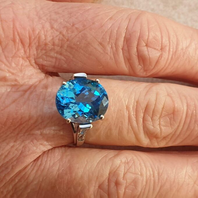Swiss Blue Topaz Solitaire Ring in 9ct White Gold,  a UK N 1/2 or a US 7 1/4.