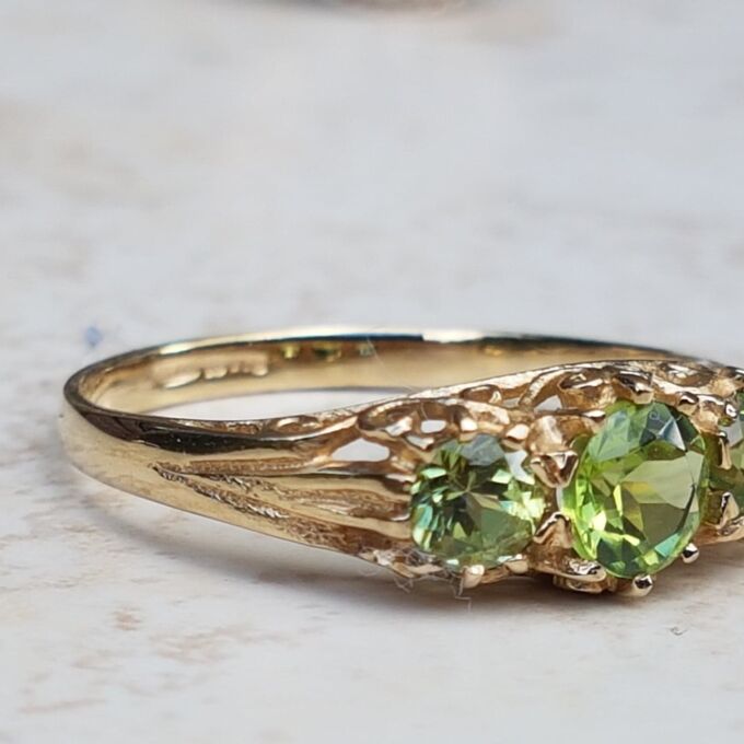 Summery Peridot Three Stone Ring in 9ct Gold, a UK N 1/2 or a US 7 1/4.