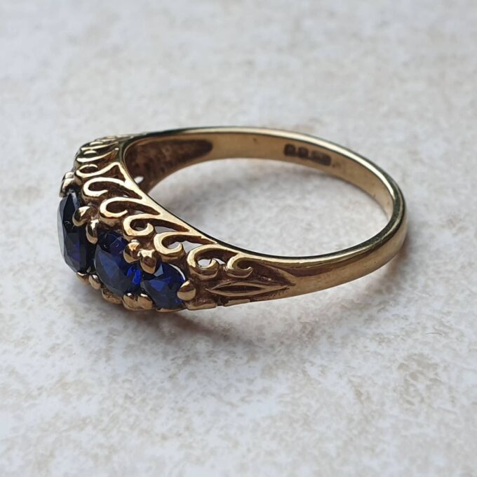 Vibrant Blue Five Stone Synthetic Sapphire Ring in 9ct Gold, a UK N or a US 7.