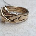Four Piece Puzzle Ring in 9ct Gold, a UK N 1/2 or a US 7 1/2