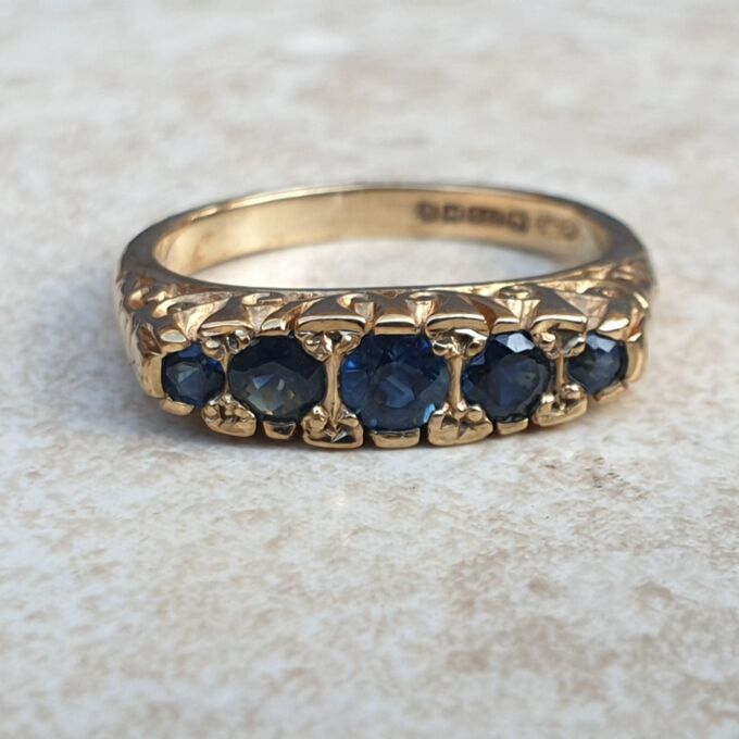 Blue Sapphire Five Stone Ring in 9ct Yellow Gold, a UK K 1/2 or a US 5 3/4.