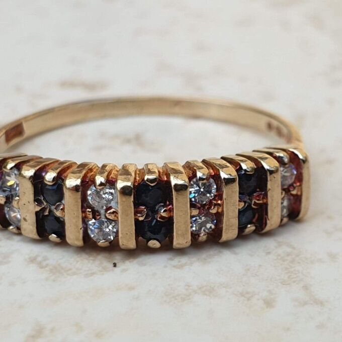 Sapphire and Paste Duo Stone Band in 9ct Gold,  a UK N or a US 7.