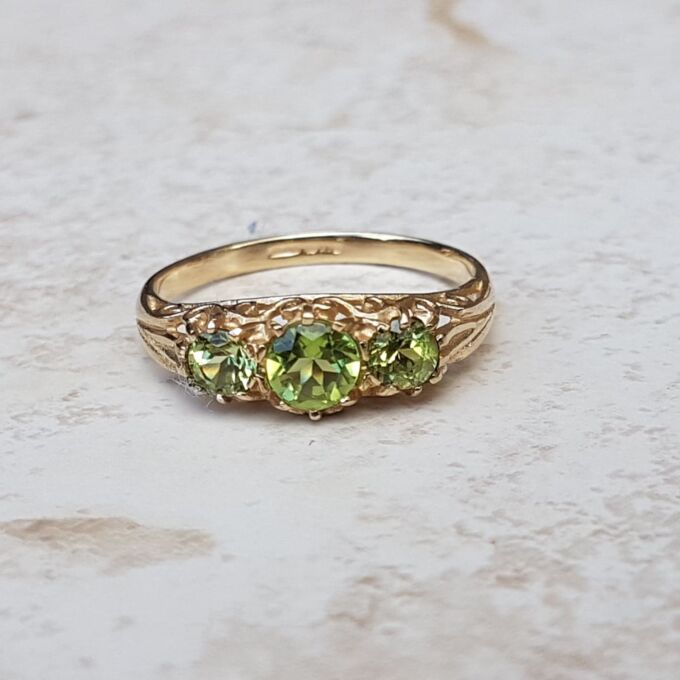 Summery Peridot Three Stone Ring in 9ct Gold, a UK N 1/2 or a US 7 1/4.