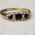 Three Stone Sapphire Ring with Diamonds in 9ct Gold, a UK O 1/2 or a US 7 1/2.