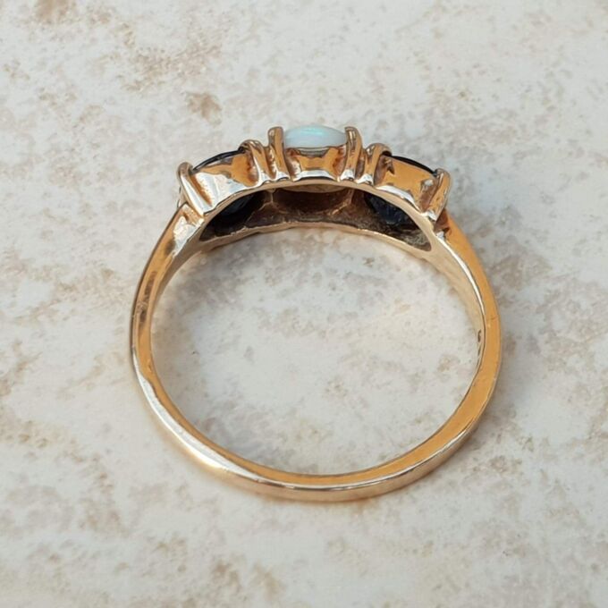 Opal and Sapphire Trilogy Ring in 9ct Gold, a UK J 1/2 or a US 5 1/4.