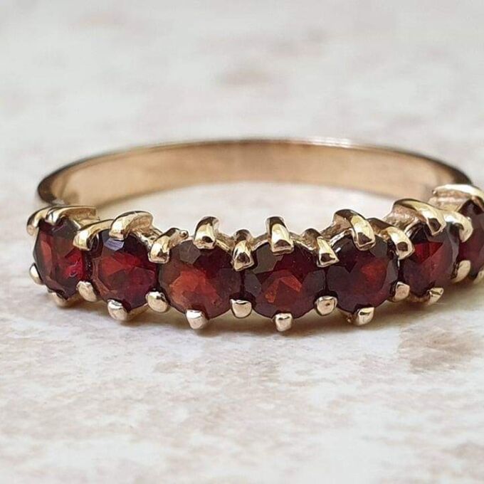 Seven Stone Garnet Band in 9ct Gold, a UK L 1/2 or a US 6
