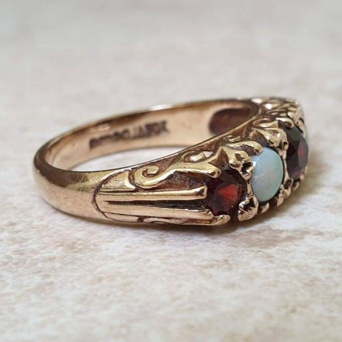 Five Stone Opal and Garnet 9ct Gold Ring, a UK K 1/2 or a US size 5 3/4.