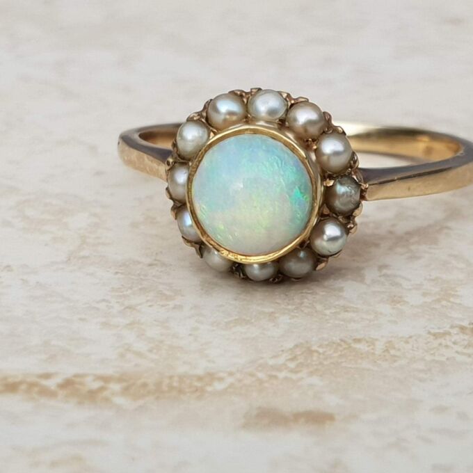 Stunning Opal and Split Pearl Halo Ring in 9ct Gold, a UK L 1/2 or a US 6 1/4.