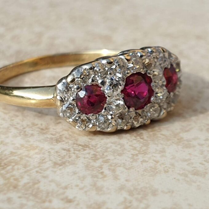 Trilogy Ruby and Diamond Ring in 18ct Gold,  a UK H 1/2 or a US 4 1/4.