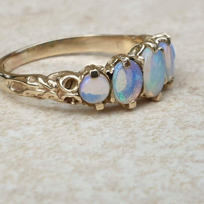 Graduating Five Stone Opal Ring in 9ct Gold,  a UK O or a US 7 3/4.
