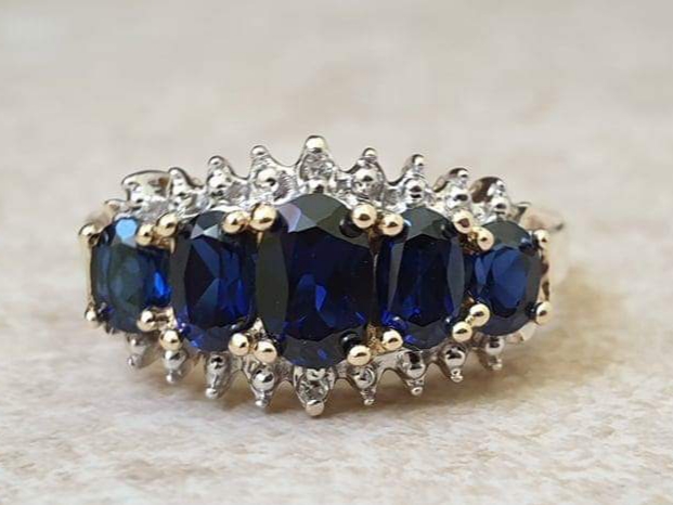 Graduating Synthetic Sapphire Five Stone Ring in 10k Gold.
