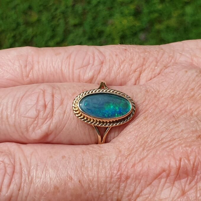Oval Opal Doublet Ring in 9ct gold, a UK O or a US 7 1/2