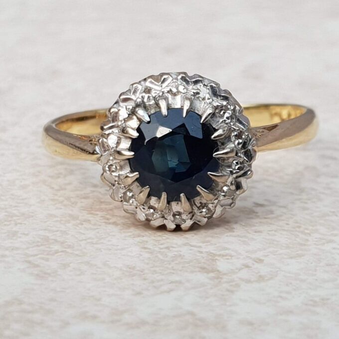 Sapphire and Diamond Halo ring in 18ct Gold and Platinum, a UK M or a US 6 1/2.