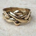 Four piece Puzzle Ring in 9ct Gold,  a UK P 1/2 or a US 8.
