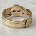 Four piece Puzzle Ring in 9ct Gold,  a UK P 1/2 or a US 8.