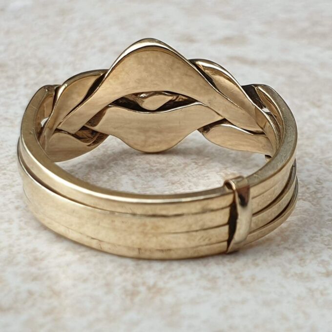 Four piece Puzzle Ring in 9ct Gold,  a UK P 1/2 or a US 8.