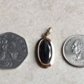 Oval Hematite Pendant in 9ct Gold.