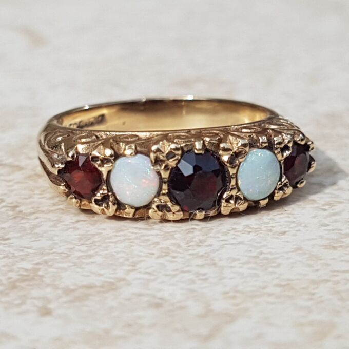 Five Stone Opal and Garnet 9ct Gold Ring, a UK K 1/2 or a US size 5 3/4.