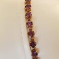 Amethyst Tennis Bracelet in 9ct Gold,  7 1/4 inches in length.
