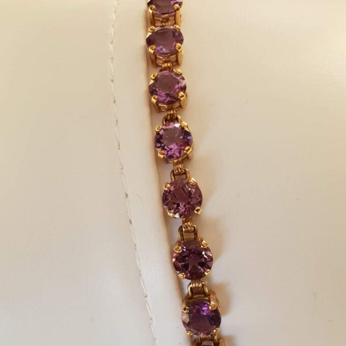 Amethyst Tennis Bracelet in 9ct Gold,  7 1/4 inches in length.