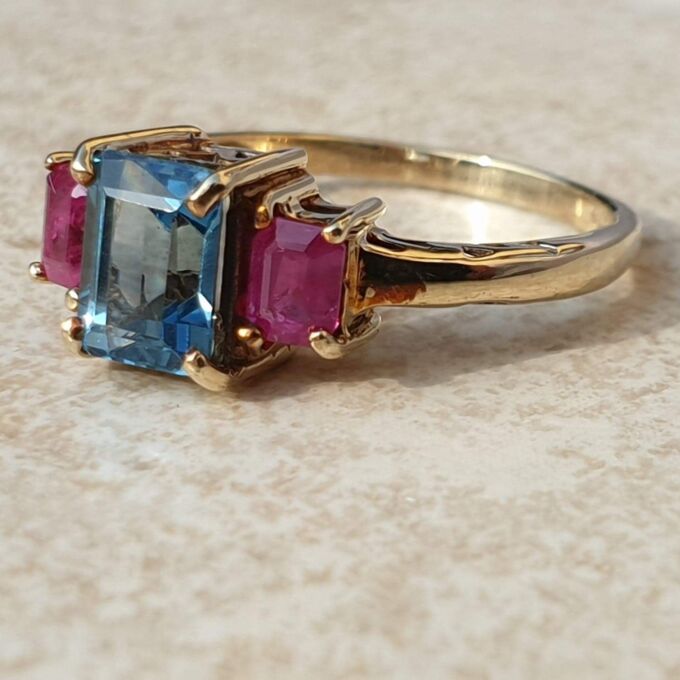 Topaz and Synthetic Ruby Trilogy Ring in 9ct Gold.