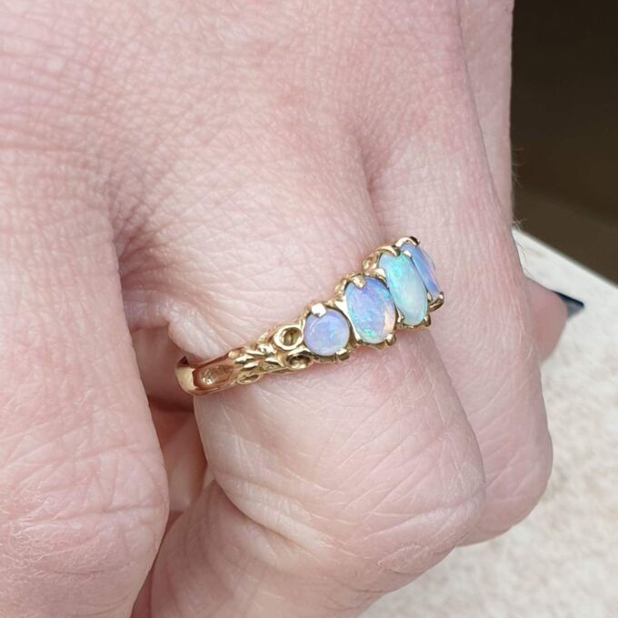Graduating Five Stone Opal Ring in 9ct Gold,  a UK O or a US 7 3/4.