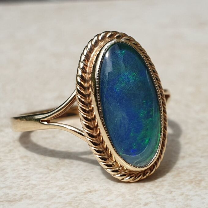 Oval Opal Doublet Ring in 9ct gold, a UK O or a US 7 1/2