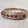 REGARDS Acrostic Ring in 9ct Gold, a UK O or a US 7 1/2