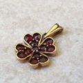 Garnet Four Leaf Clover Pendant in 9ct Gold