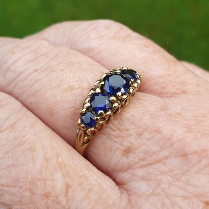 Vibrant Blue Five Stone Synthetic Sapphire Ring in 9ct Gold, a UK N or a US 7.