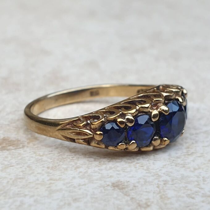 Vibrant Blue Five Stone Synthetic Sapphire Ring in 9ct Gold, a UK N or a US 7.