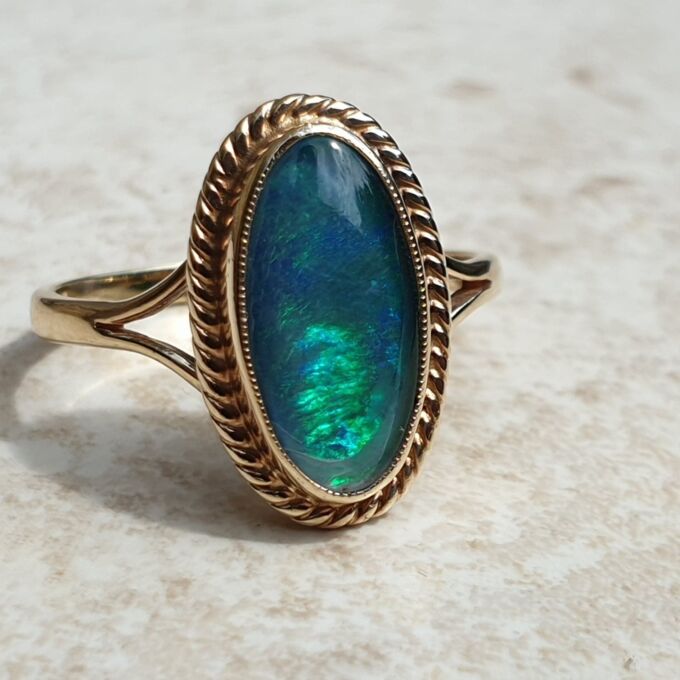 Oval Opal Doublet Ring in 9ct gold, a UK O or a US 7 1/2