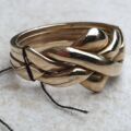 Four Piece Puzzle Ring in 9ct Gold, a UK N 1/2 or a US 7 1/2