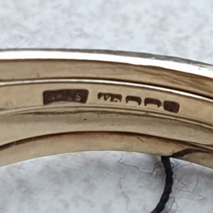 Four Piece Puzzle Ring in 9ct Gold, a UK N 1/2 or a US 7 1/2