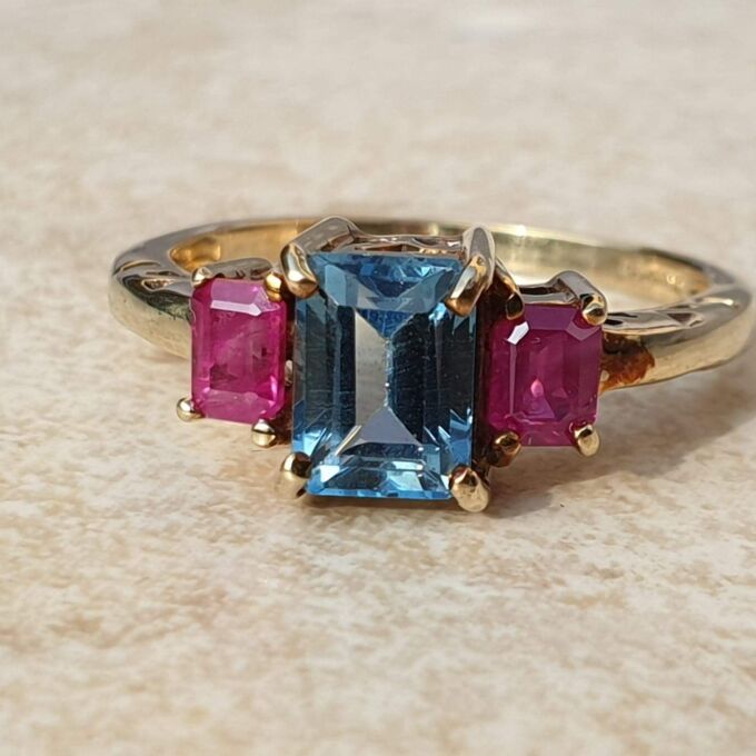 Topaz and Synthetic Ruby Trilogy Ring in 9ct Gold.