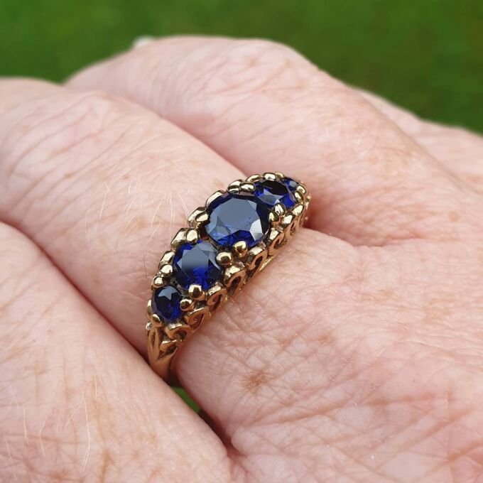 Vibrant Blue Five Stone Synthetic Sapphire Ring in 9ct Gold, a UK N or a US 7.