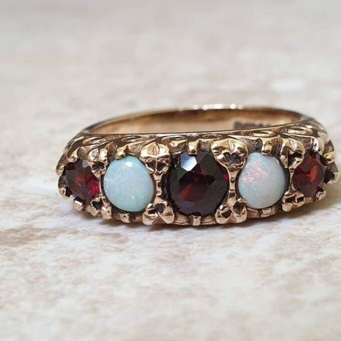Five Stone Opal and Garnet 9ct Gold Ring, a UK K 1/2 or a US size 5 3/4.