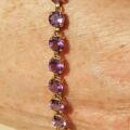 Amethyst Tennis Bracelet in 9ct Gold,  7 1/4 inches in length.