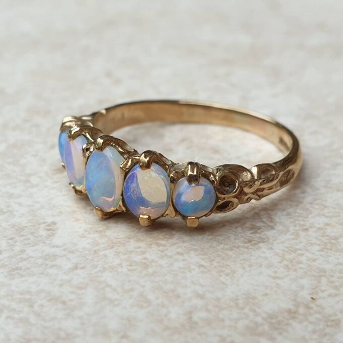 Graduating Five Stone Opal Ring in 9ct Gold,  a UK O or a US 7 3/4.