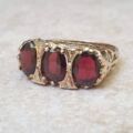 Three Stone Garnet Ring in 9ct Gold.