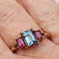 Topaz and Synthetic Ruby Trilogy Ring in 9ct Gold.
