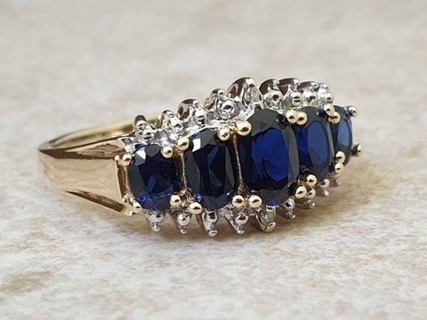 Graduating Synthetic Sapphire Five Stone Ring in 10k Gold.