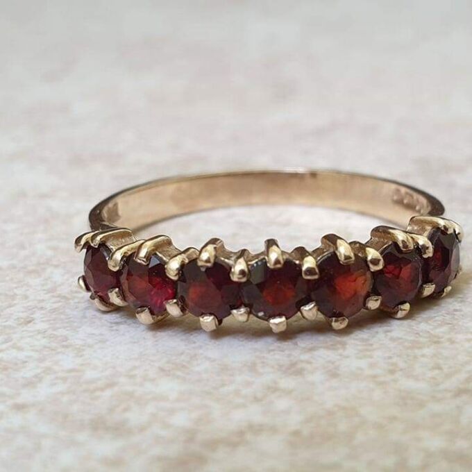 Seven Stone Garnet Band in 9ct Gold, a UK L 1/2 or a US 6
