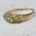 Summery Peridot Three Stone Ring in 9ct Gold, a UK N 1/2 or a US 7 1/4.