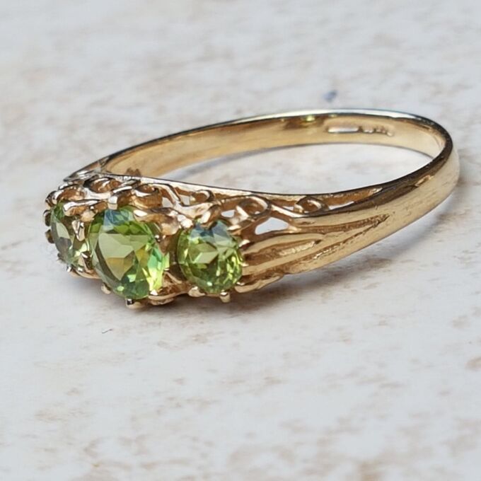 Summery Peridot Three Stone Ring in 9ct Gold, a UK N 1/2 or a US 7 1/4.